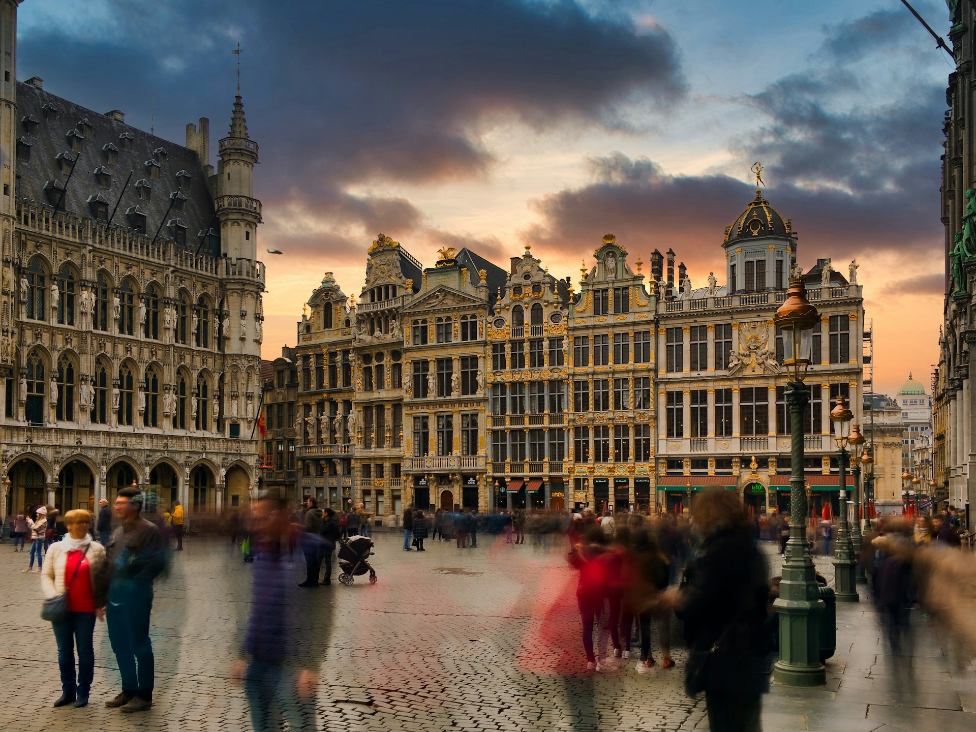 A beautiful square full of people in Brussels at sunset